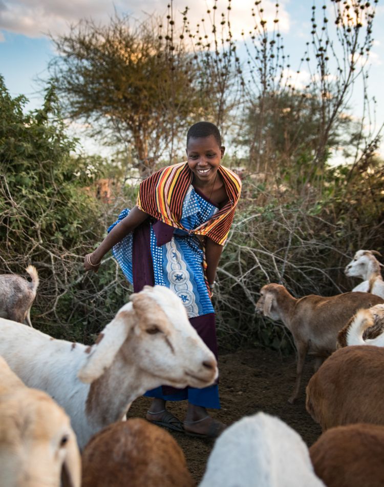 A young girl with goats in northern Tanzania.