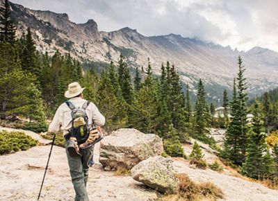 A park visitor hiking up to Mills Lake in Rocky Mountain National Park.